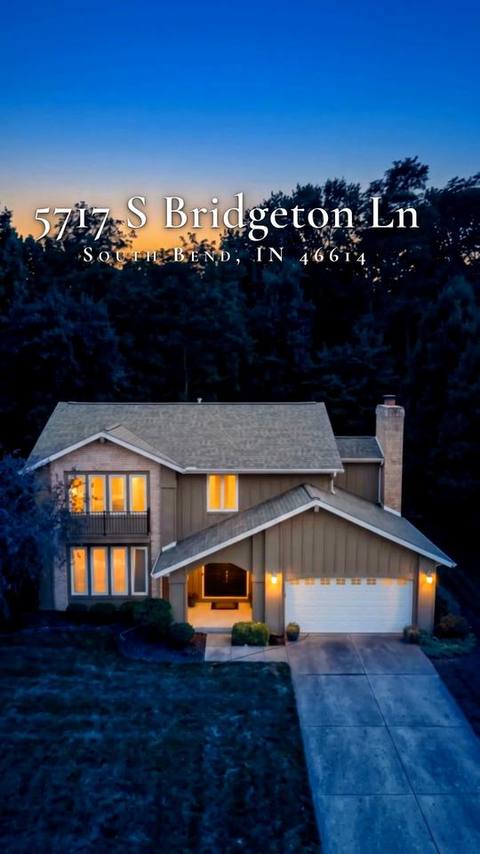 Closing frame of the reel: deep-blue twilight aerial of the house with warm window light and the address title