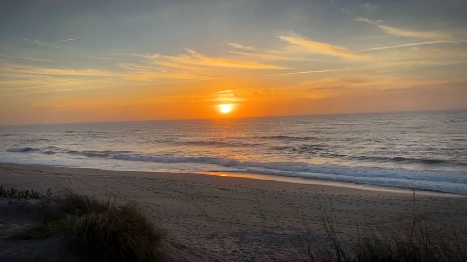 Sunrise over the sea from a quiet beach