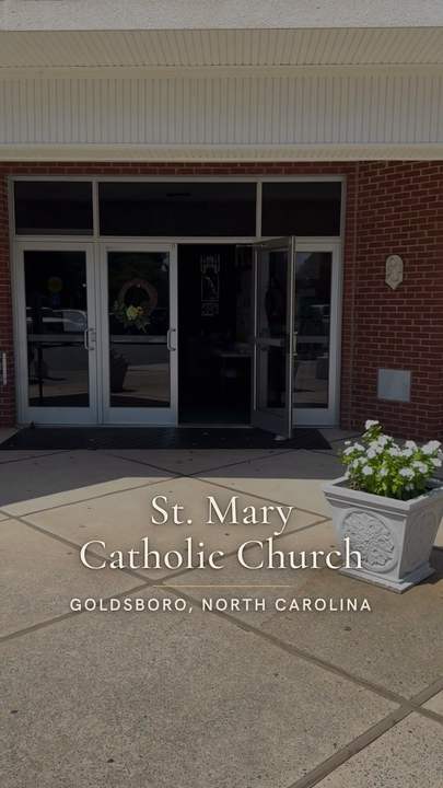 Title card over the church entrance: St. Mary Catholic Church, Goldsboro, North Carolina, in a quiet serif