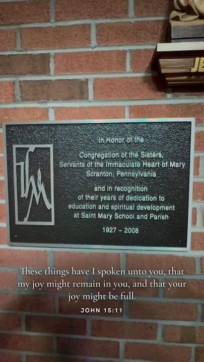 John 15:11 verse card placed on the brick below a memorial plaque